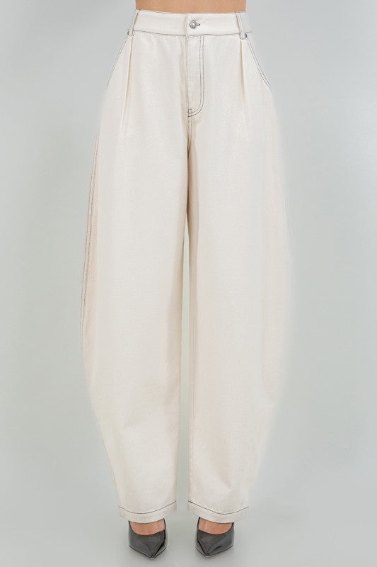 Woman wearing soft washed cotton barrel leg pants in a relaxed fit, styled for casual comfort and modern everyday wear.