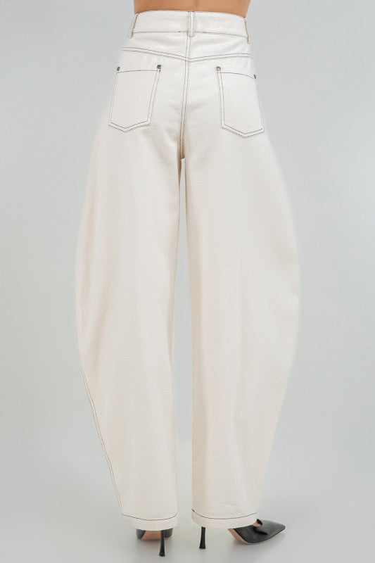 Woman wearing soft washed cotton barrel leg pants in a relaxed fit, styled for casual comfort and modern everyday wear.