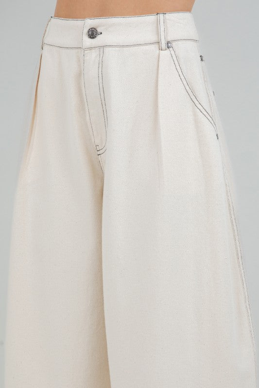 Woman wearing soft washed cotton barrel leg pants in a relaxed fit, styled for casual comfort and modern everyday wear.