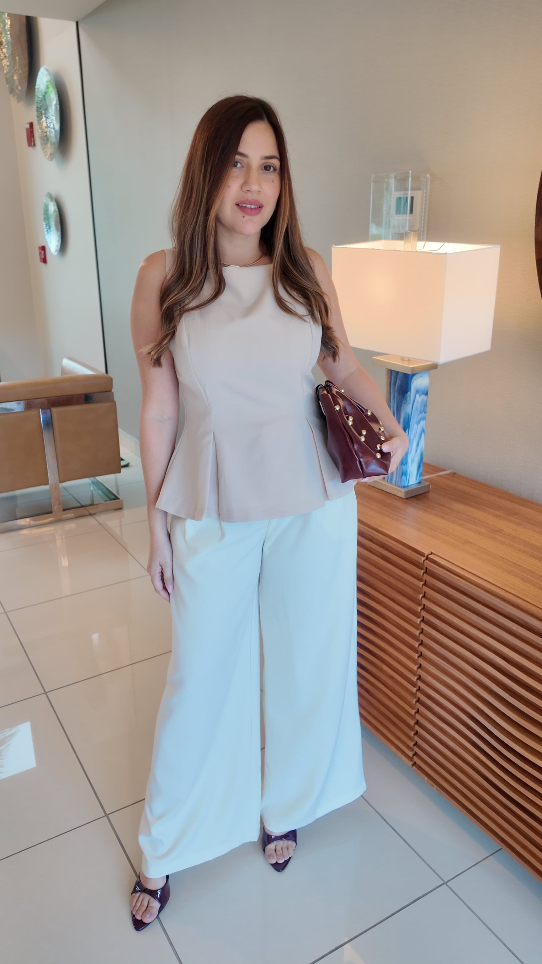 Women’s boat neck sleeveless top, elegant and versatile summer blouse, chic wardrobe essential.