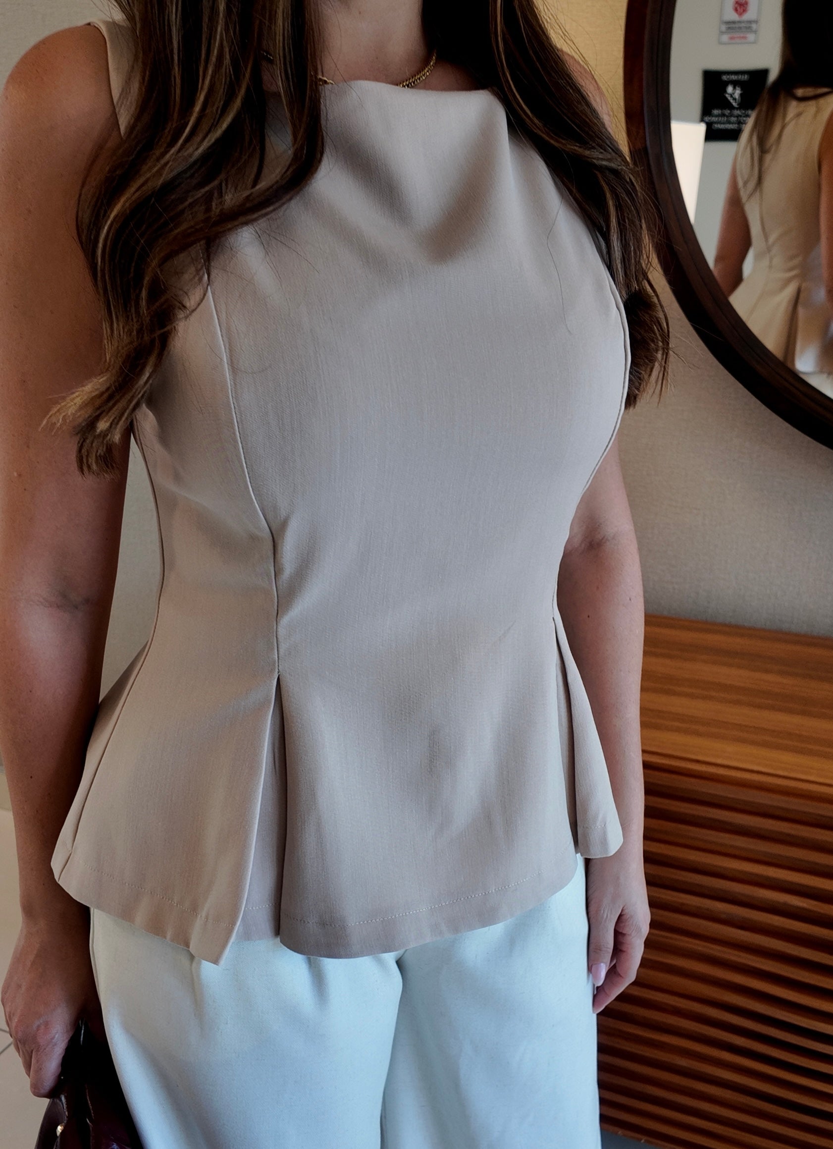 Women’s boat neck sleeveless top, elegant and versatile summer blouse, chic wardrobe essential.